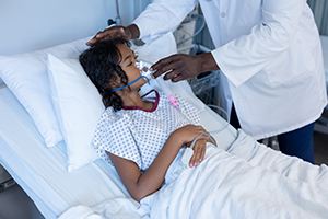 doctor putting ventilator on child